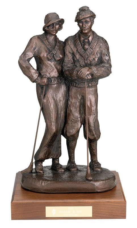 Durastone male & female golf partners sculpture on walnut base