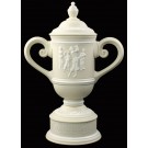 Cream & white ceramic trophy cup with vintage female golf scene & sand carved copy and/or logo - 14" ht.