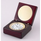 Rosewood & gold tone clock with round engraving plate - 2 3/4" w. 1 1/2" ht.